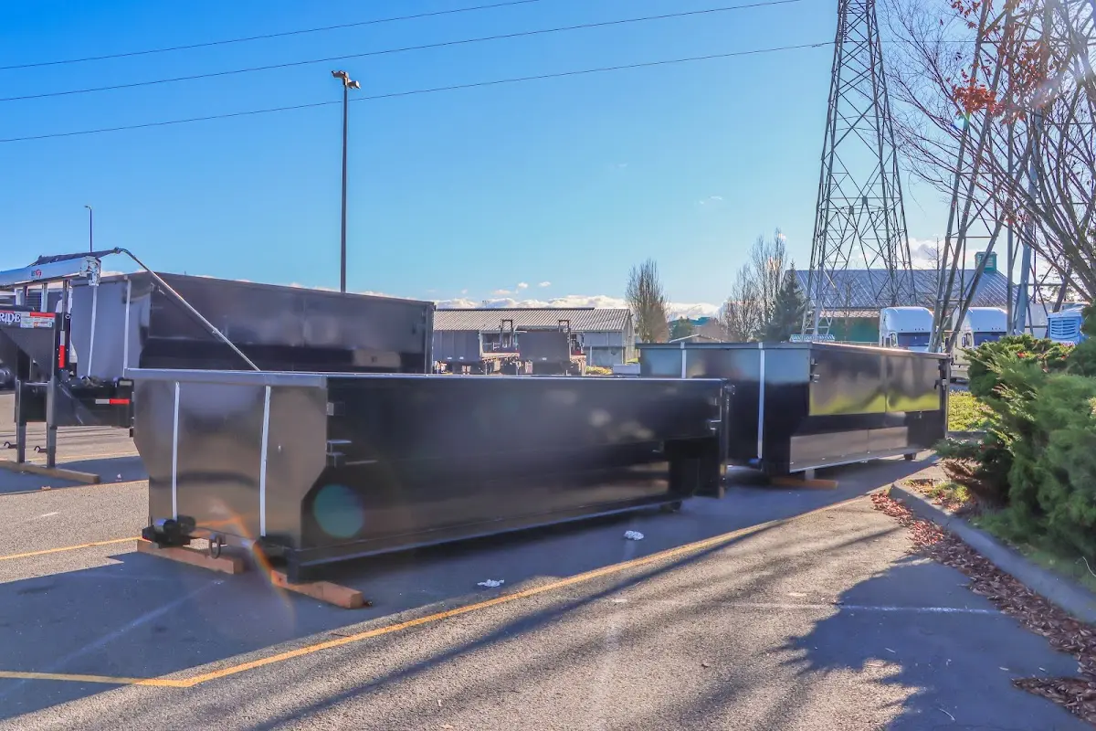 Roll-off dumpster ready for waste disposal at job site for Concrete Dumpster Rental in Bangor